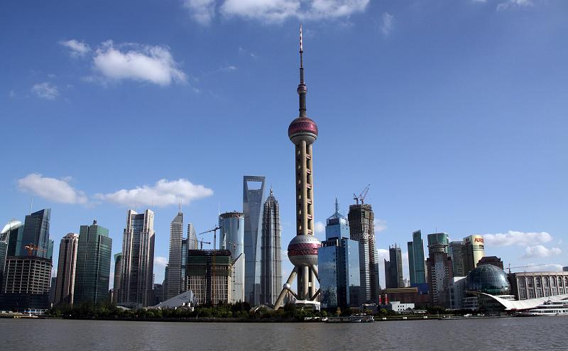 Pudong_View_08.jpg - Pudong: The skyline with the futuristic Oriental Pearl TV tower (468 meters high). In the back the building that looks like a shopping bag is the WTC (World Financial Center) with 492 meters hight, even bigger...