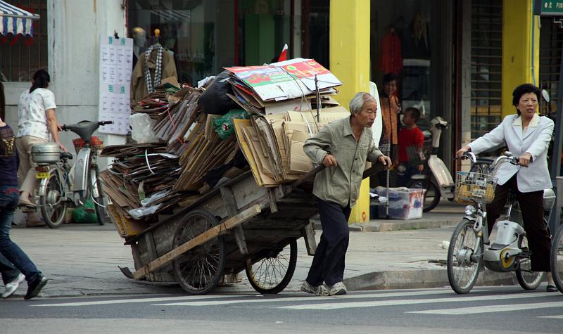 Street_People_Detail_01.jpg - Suzhou: Recyling. Beside this man collection carton, many people collect PET, paper and metal. They take it directly out of the waste bin...